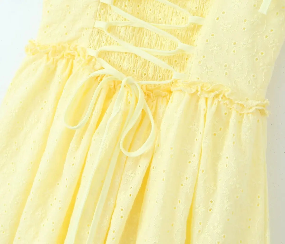 YENKYE Sexy Elegant Women Hollow Out Embroidery Yellow Sling Mini Dress Low Waist Lace Up Bandage Party Dresses Birthday Robe