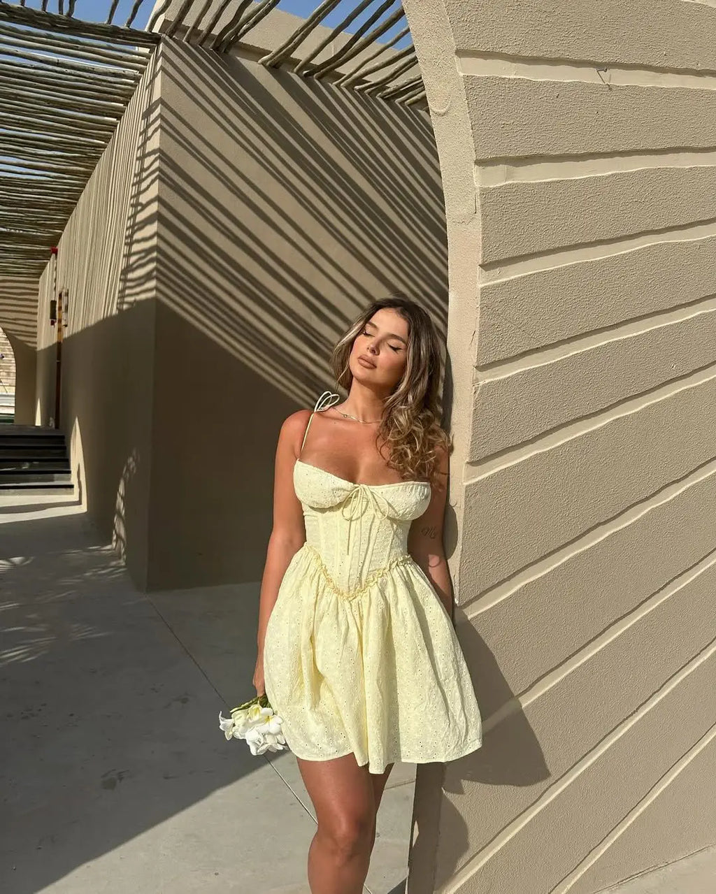 YENKYE Sexy Elegant Women Hollow Out Embroidery Yellow Sling Mini Dress Low Waist Lace Up Bandage Party Dresses Birthday Robe