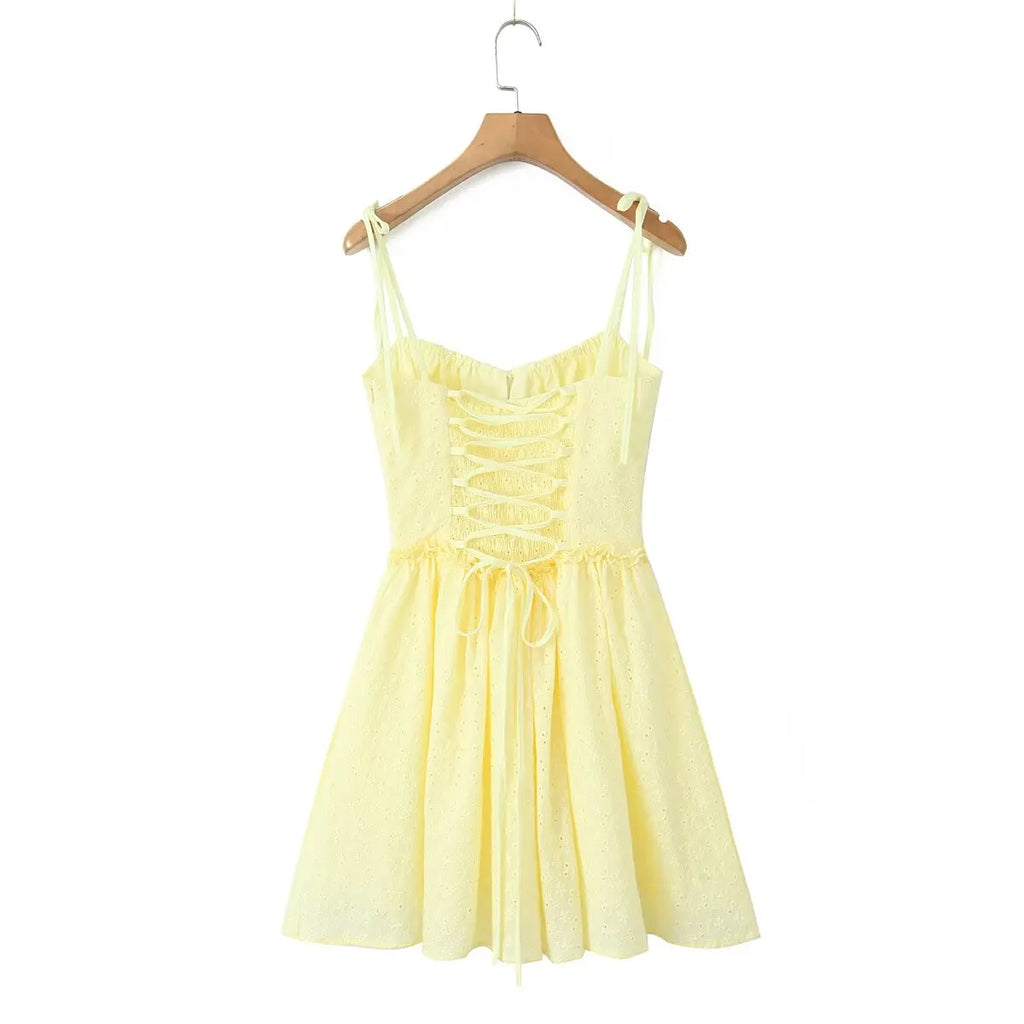 YENKYE Sexy Elegant Women Hollow Out Embroidery Yellow Sling Mini Dress Low Waist Lace Up Bandage Party Dresses Birthday Robe