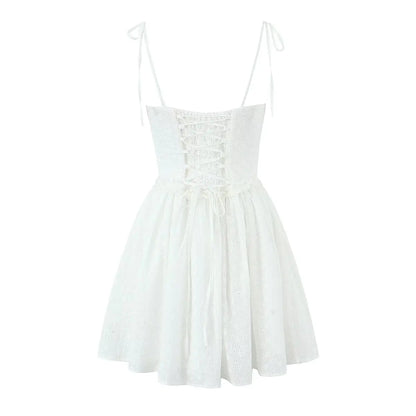 YENKYE Sexy Elegant Women Hollow Out Embroidery Yellow Sling Mini Dress Low Waist Lace Up Bandage Party Dresses Birthday Robe