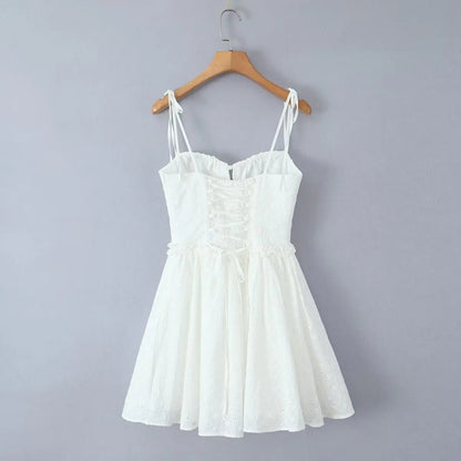 YENKYE Sexy Elegant Women Hollow Out Embroidery Yellow Sling Mini Dress Low Waist Lace Up Bandage Party Dresses Birthday Robe